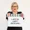 Business Branding Photography - Digital Media BusinessWoman standing hold film board with "Lets Get Social"